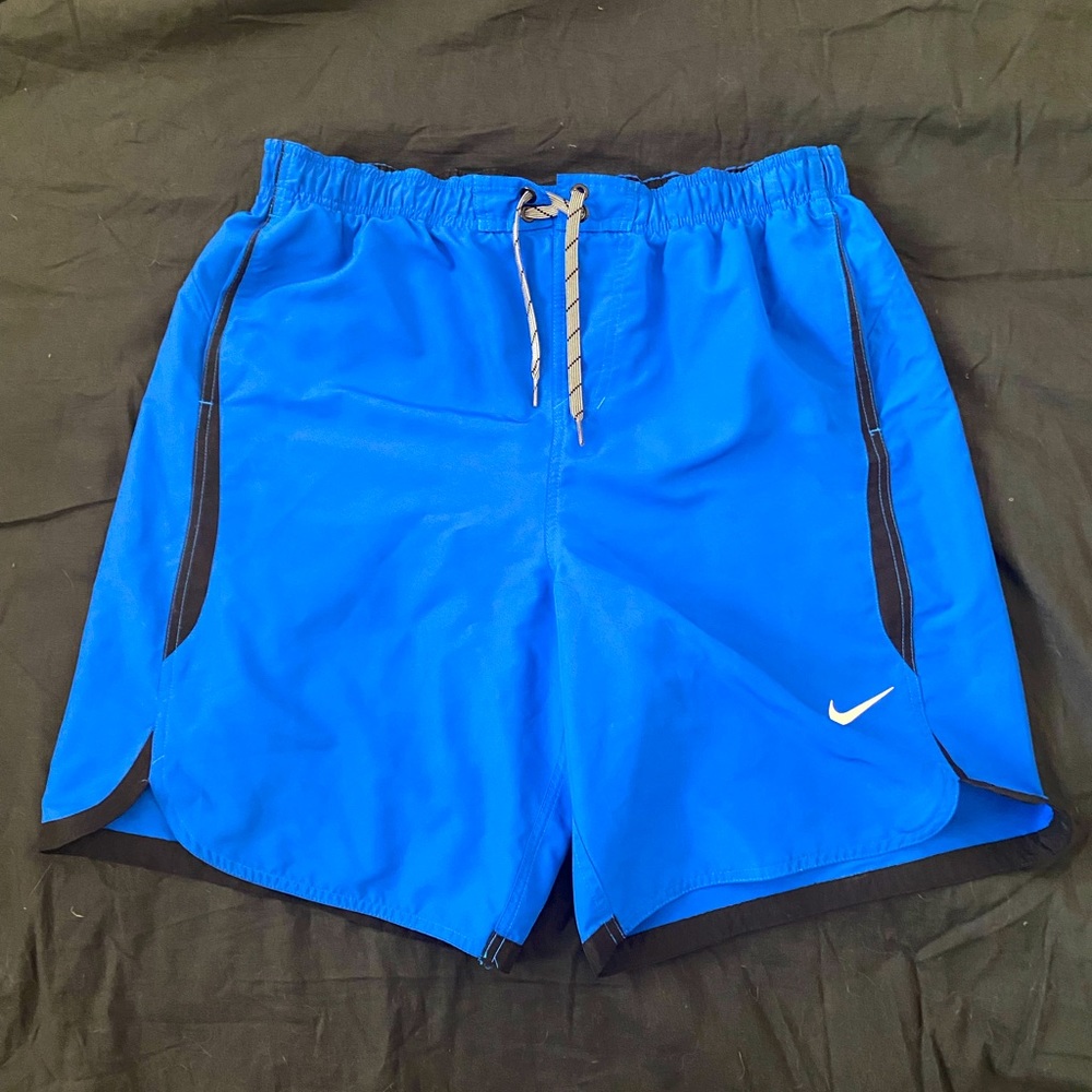 Nike swim trunks bright blue with black outline